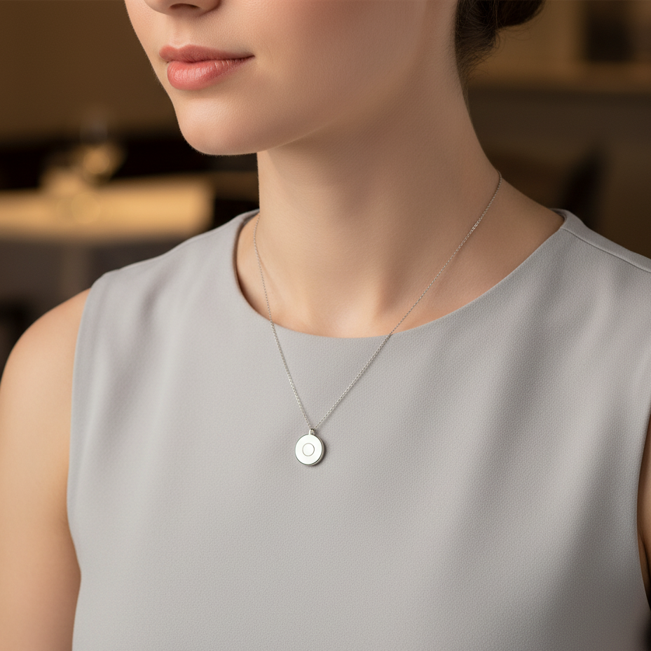 Closeup of woman wearing the silver Safetrack Aura necklace